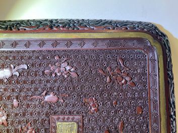 A pair of Chinese black and red cinnabar lacquer square dishes, Qianlong mark and of the period